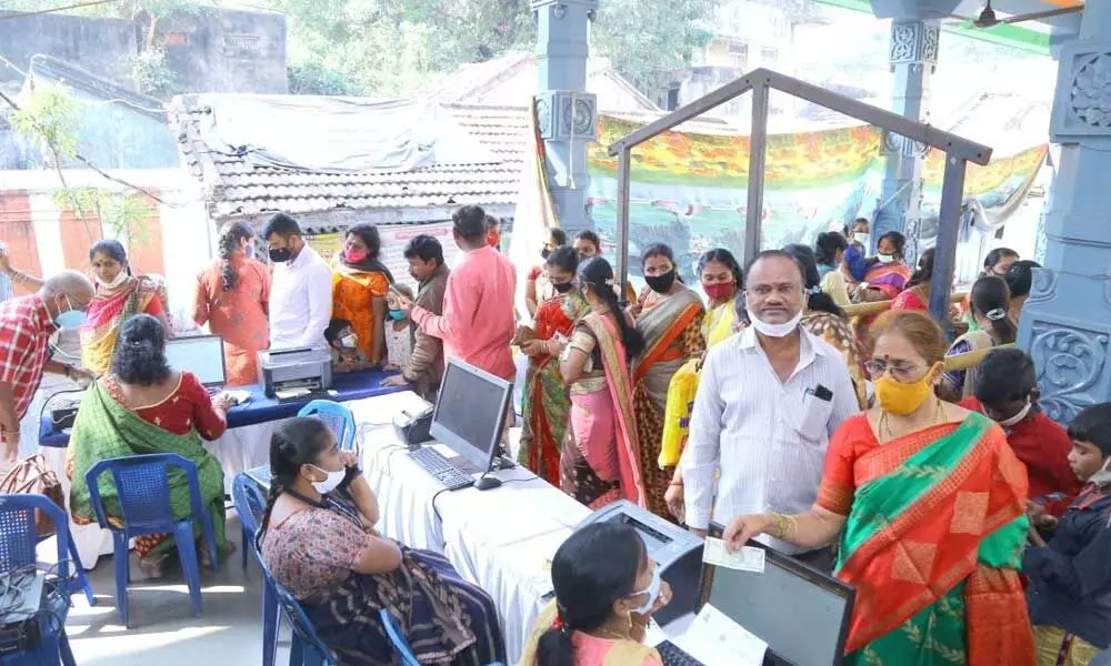 Devotees booking slots for darshan at Sri Kanaka Maha Lakshmi temple in Visakhapatnam on Monday