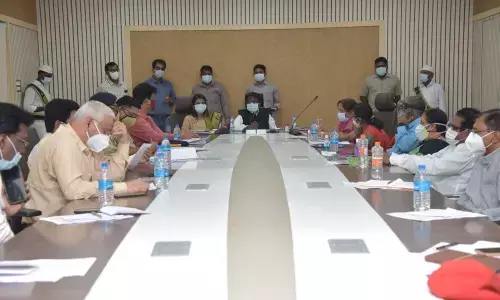 District Collector I Samuel Anand Kumar addressing a meeting in Guntur on Monday