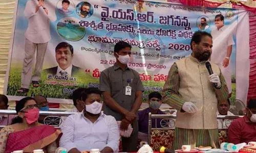 Assembly Speaker Tammineni Sitaram addressing a public meeting after launching ‘Mee Bhumi -Maa Haami’ programme in Kondalakkivalasa village in Srikakulam  on Tuesday