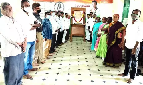 Congress leaders paying floral tributes to the portrait of former Prime Minister P V Narasimha Rao on the occasion of his 16th death anniversary at party office in Kurnool on Wednesday