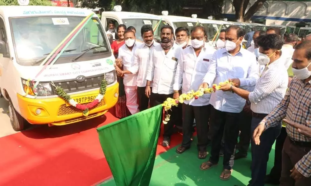 MLA Bhumana Karunakar Reddy flagging off the mini waste collection trucks in Tirupati on Thursday