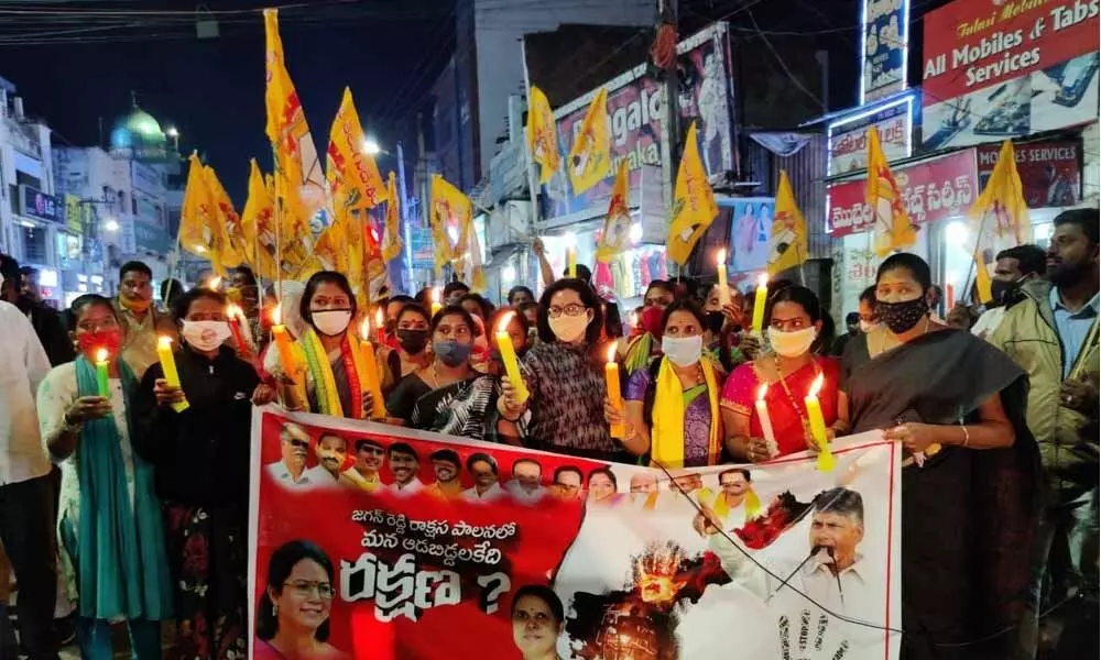 TDP leader P Aditi Gajapathi Raju and others staging a candle rally protesting the brutal murder of dalit girl in Anantapur, in Vizianagaram on Thursday