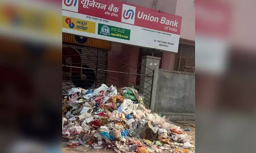Garbage dumped at the entrance of a bank in Vuyyuru