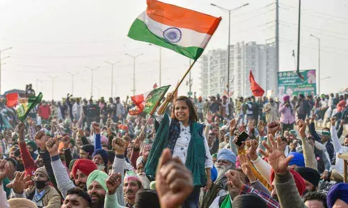 Farmers raise slogans during their protest against the Centres new farm laws at Ghazipur border, in New Delhi on Thursday