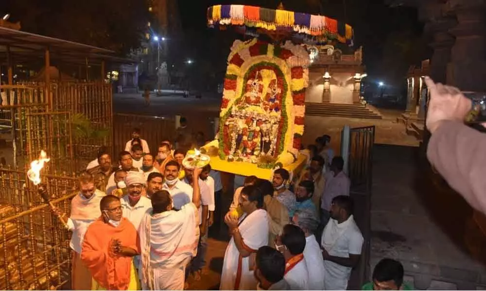 Devotees taking the Lord in a procession at Srisailam temple on the occasion of Mukkoti Ekadasi on Friday