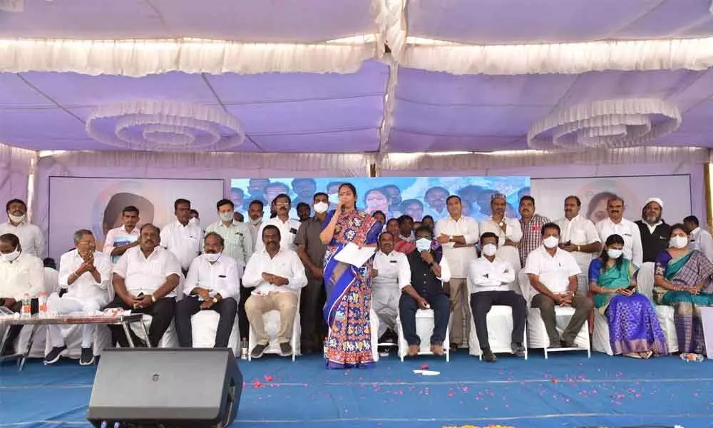 Home Minister Mekathoti Sucharita addressing a meeting held at Etukuru on the occasion of distribution of house sites to the poor