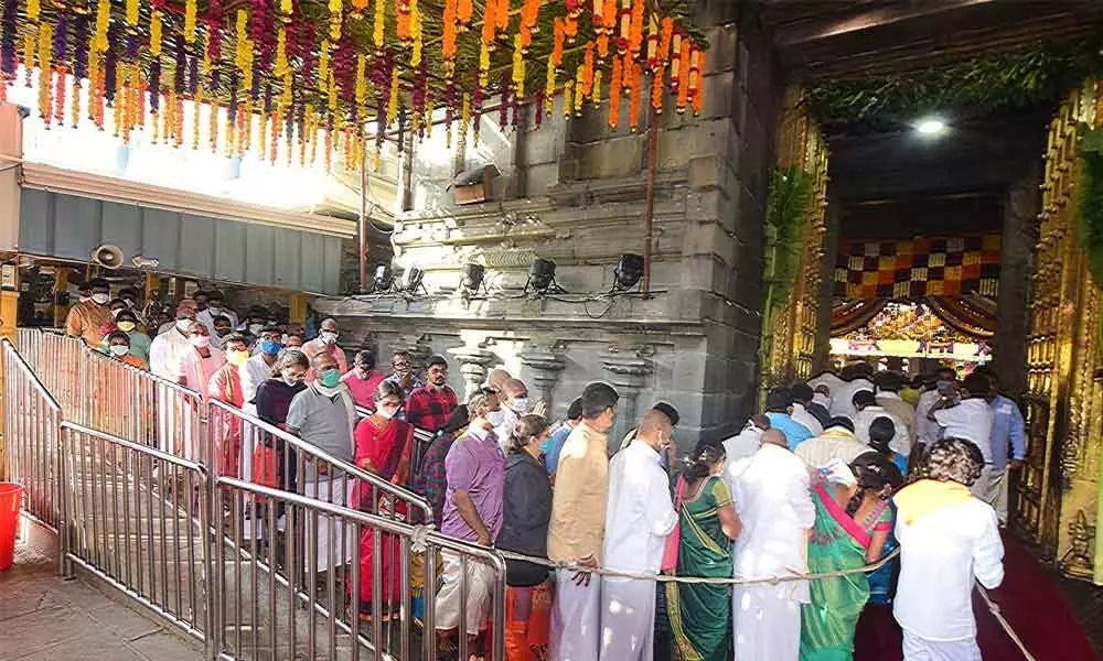 Devotees in queue line for darshan on Friday