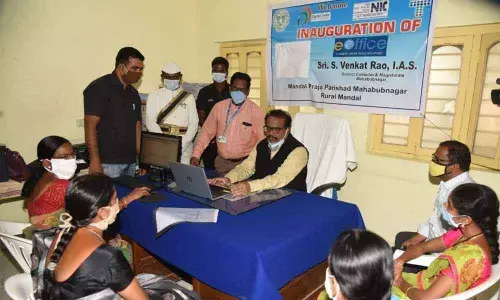District Collecrtor S Venkat Rao launhing e-office system at a government office