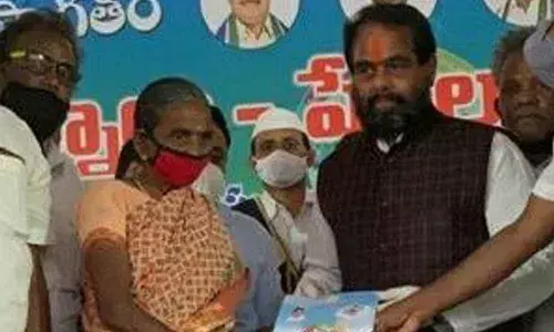 Assembly Speaker T Sitaram distributing house site pattas to poor women at Gajulakollivalasa in Amudalavalasa mandal in Srikakulam district on Friday