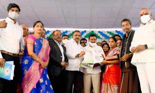 Transport Minister Perni Nani distributing house site pattas to beneficiaries in Ibrahimpatnam mandal on Friday