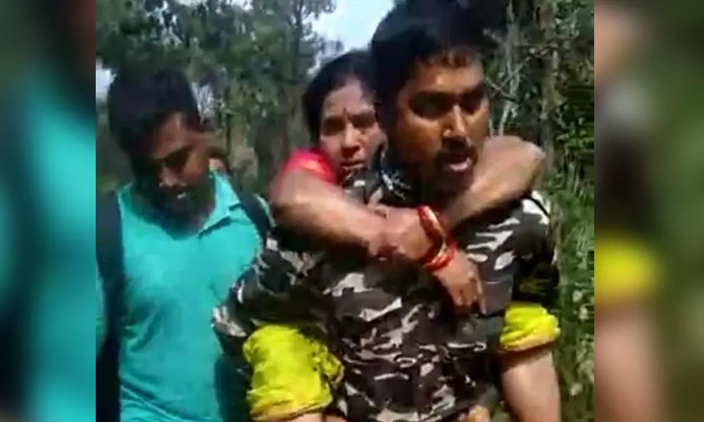 AR constable Shaik Arshad was seen carrying Nageswaramma on his back in dense forest of Seshachalam hills (file photo)