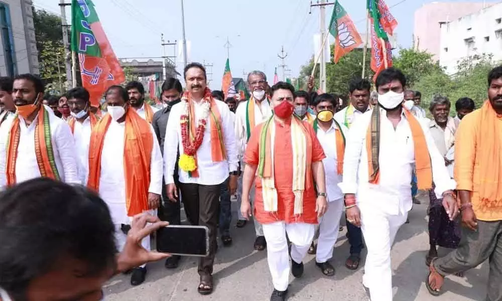 BJP AP affairs co-in-charge Sunil V Deodhar, BJP State president Somu Veerraju and other leaders take part in a roadshow in Rajampet on Monday