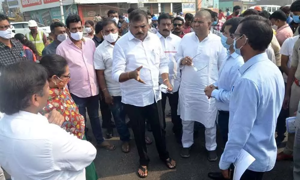 Minister for Municipal Administration and Urban Development Botcha Satyanarayana and Tourism Minister M Srinivasa Rao inspecting the progress of NAD flyover works in Visakhapatnam on Monday