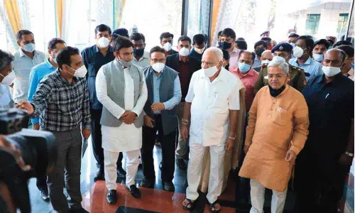 CM Yediyurappa inaugurates Arogya Soudha, pats Sudhakar for  good job