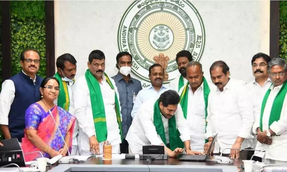 Chief Minister Y S Jagan Mohan Reddy releasing Rythu Bharosa-PM Kisan and input subsidy for Cyclone Nivar-affected farmers  at Tadepalli on Tuesday