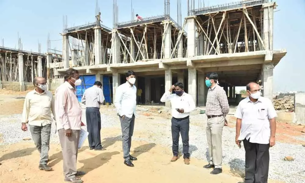 District Collector C Narayana Reddy inspecting construction works of double bedroom houses in Nizamabad