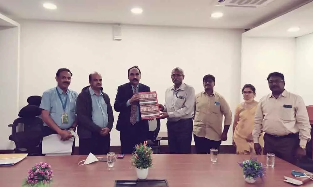 AP Transco chief engineer JV Rao and other officers submitting memorandum to airport Director Giri Madhusudana Rao to allot land for building a substation on the airport premises in Vijayawada on Monday