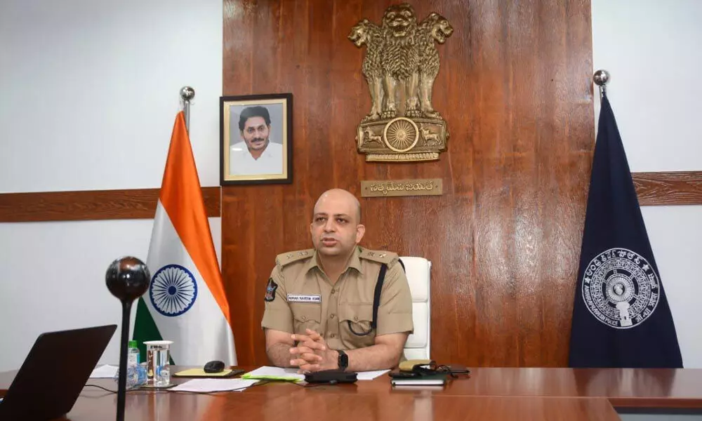 District Superintendent of Police Adnan Nayeem Asmi addressing a meeting in Kakinada on Tuesday