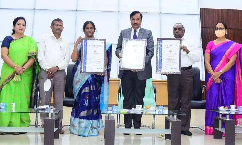 AKNU Vice-Chancellor Prof Mokka Jagannatha Rao displaying ISO certification