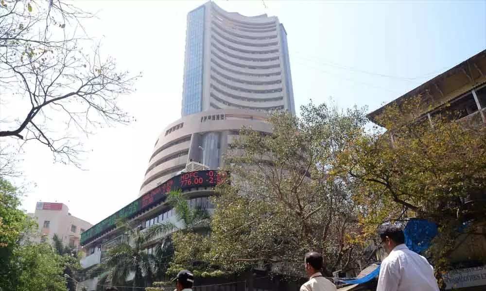 Sensex pares gains after touching fresh record high