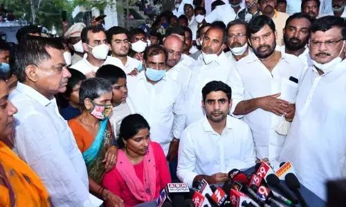 TDP National Secretary Nara Lokesh addressing the media along with murdered TDP leader N Subbaiahs wife Aparajita Reddy, in Proddutur on Wednesday