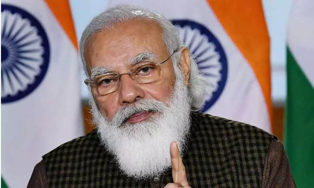 Vaccination not just enough, cautions PM Modi