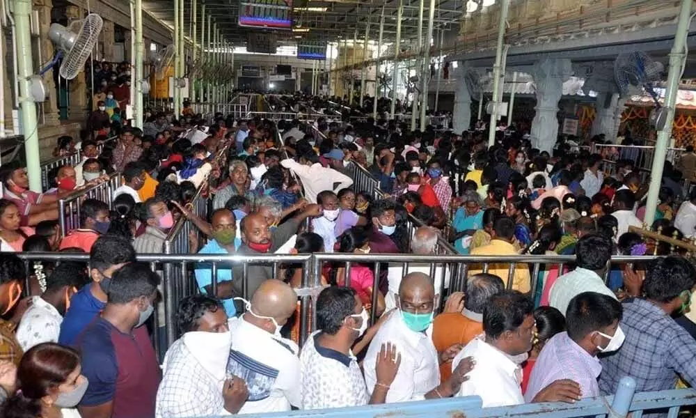 Large number of devotees waiting in queue lines at Kanipakam temple on Friday
