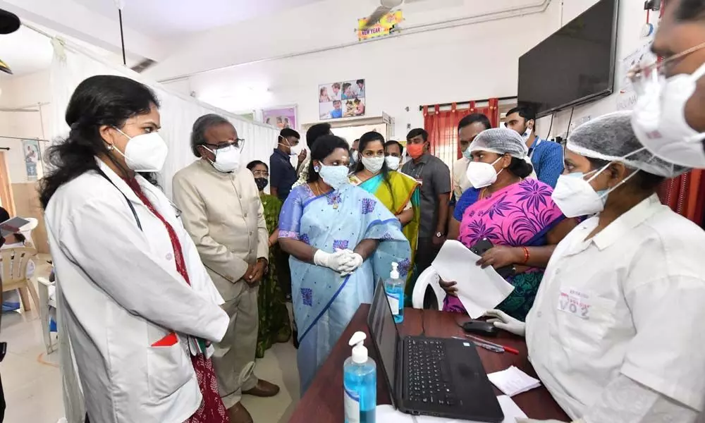 Governor Tamilisai Soundararajan interacting with Health officials during the Covid vaccine dry run at the Urban Health Centre in Tilak Nagar on Saturday