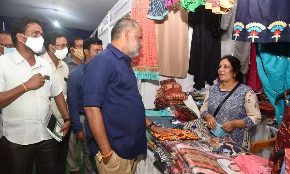 Chandragiri MLA Chevireddy Bhaskar Reddy interacting with the stallers at the handicrafts exihibition at Silparamam in Tirupati on Sunday