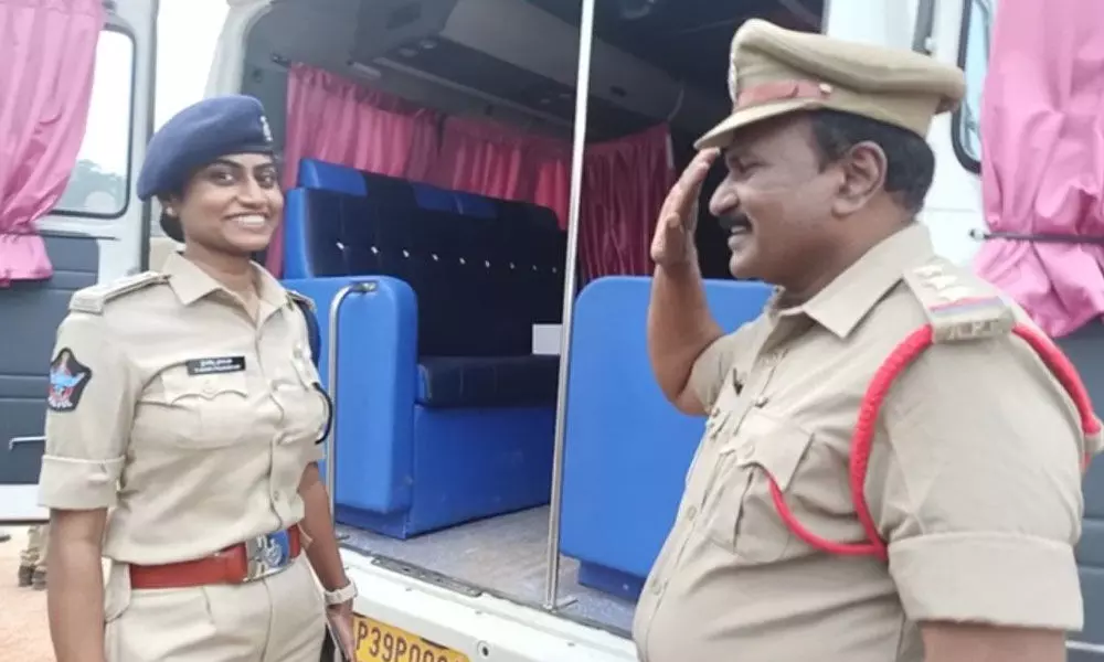 DSP Jessi Prasanthi is receiving salute from her  CI father Shyam Sundar