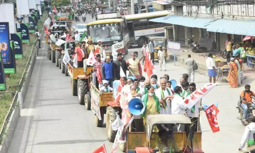 CPI national secretary K Narayana taking part in the tractor rally in support of farmers in Delhi, in Tirupati on Monday