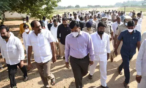 CM programme coordinator Talasila Raghuram along with the officials visiting the CM meeting venue in Nellore on Monday