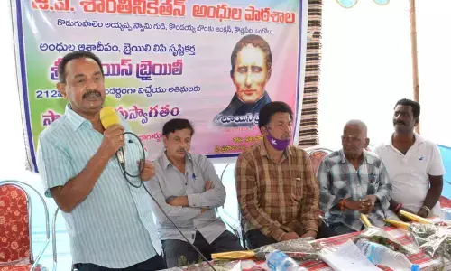 IRCS Prakasam district unit chairman Montessori Prakash speaking at the birth anniversary celebrations of Louis Braille in Ongole on Monday
