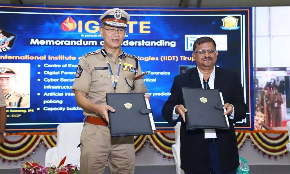 DGP D Gautam Sawang exchanging an MoU with D Mallikarjuna Reddy of Indian Institute of Design Technology at the State Police Duty Meet in Tirupati on Tuesday
