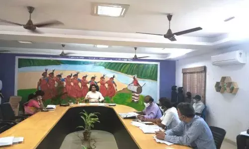 ITDA Project Officer Praveen Aditya reviewing progress of works with engineers at Rampachodavaram on Tuesday