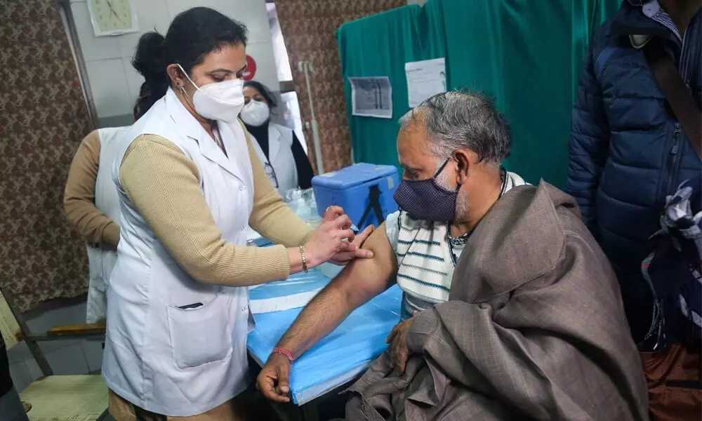 A medic conducts the dry run of Covid-19 vaccine on North Delhi Municipal Corporation Mayor Jai Prakash,at Hindu Rao Hospital in New Delhi on Wednesday