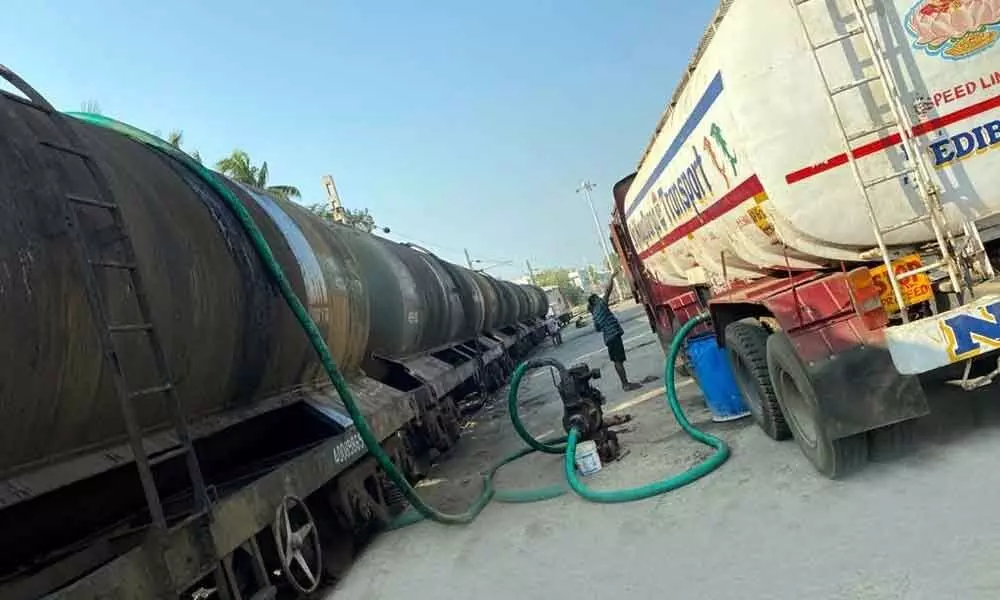 Soya bean crude oil being loaded into wagon