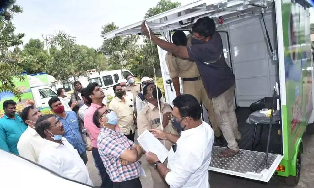 Joint Collector G C Kishore inspecting the vans to be used for door delivery of essentials