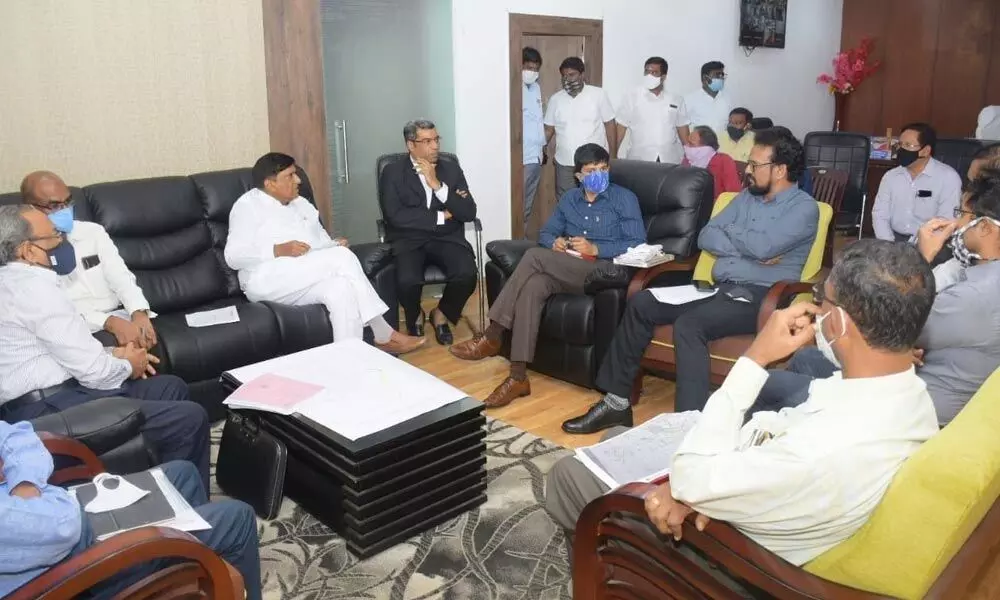 State Planning Commission Vice-President B Vinod Kumar discussing about land acquisition for laying railway line, with district officials at a meeting at Sircilla Collector’s chamber on Wednesday