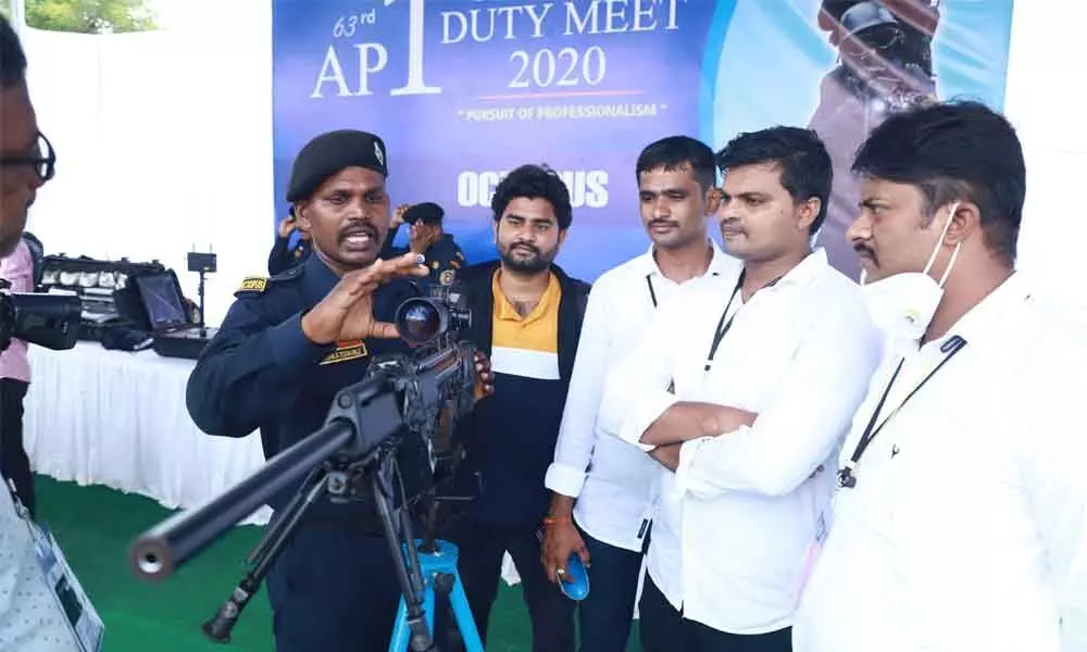 Octopus sleuths explaining the features of  a new  weapon at the AP Police Duty Meet in Tirupati