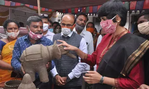 District Collector Harichandana taking a look at a clay item at a pottery exhibition in Nayaranpet on Wednesday