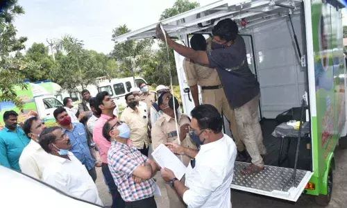 Joint Collector G C Kishore inspecting the vans to be used for door delivery of essentials