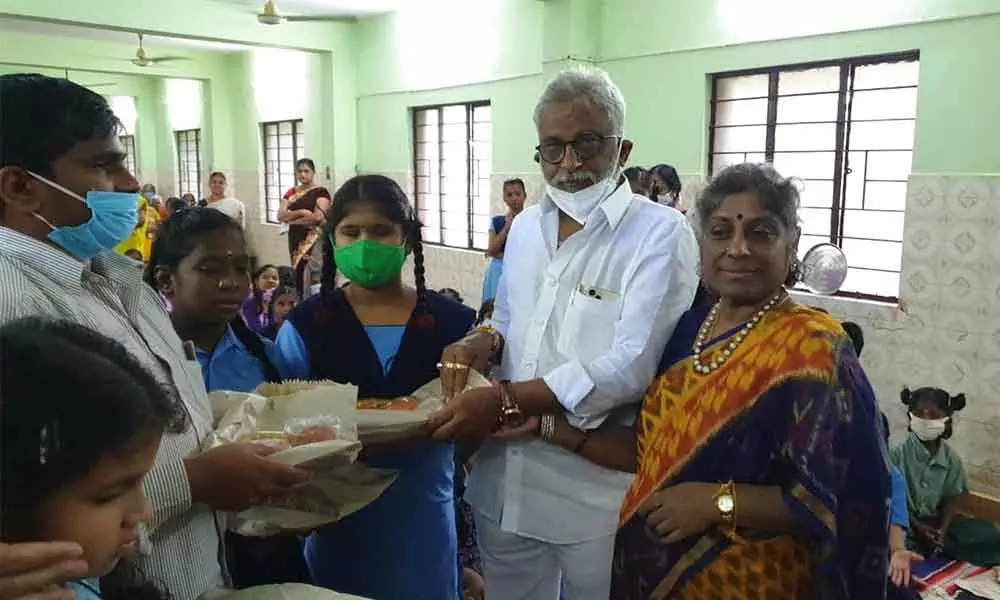 TTD Chairman Y V Subba Reddy presenting clothes and sweets to blind students at Home for Blind and Old Age people in Tirupati on Thursday