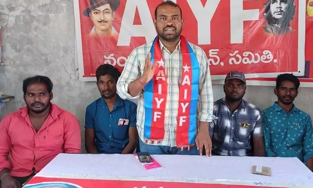 AIYF state vice-president G Naga Ramudu addressing media at its federation office in Nandyal on Friday