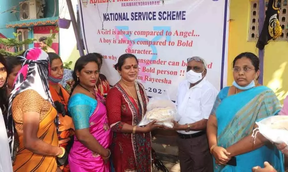 Adikavi Nannaya University Registrar Dr B Ganga Rao distributing essential commodities to transgenders in Rajamahendravaram on Friday
