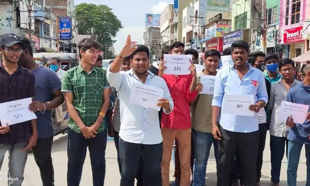SFI activists staging a protest against corporate college managements collecting excess fees in Chittoor on Saturday