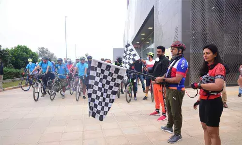 Corporate executives take part in The Signature Ride