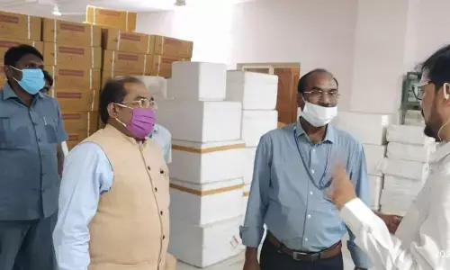 Krishna District Collector Md Imtiaz discussing with the officials at the Covid vaccination centre in Gannavaram on Sunday