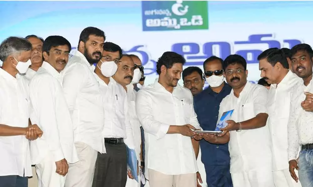 Chief Minister Y S Jagan Mohan Reddy releasing the Amma Vodi second phase payments at a public meeting  in Nellore on Monday