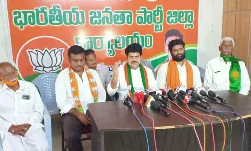 BJP Kisan Morcha State vice-president PV Krishna Reddy addressing a press meet in Ongole on Monday